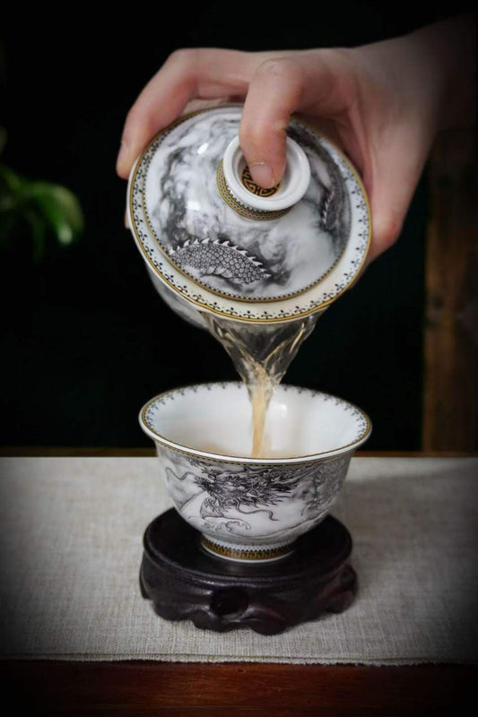 Ink Dragon gaiwan pouring tea